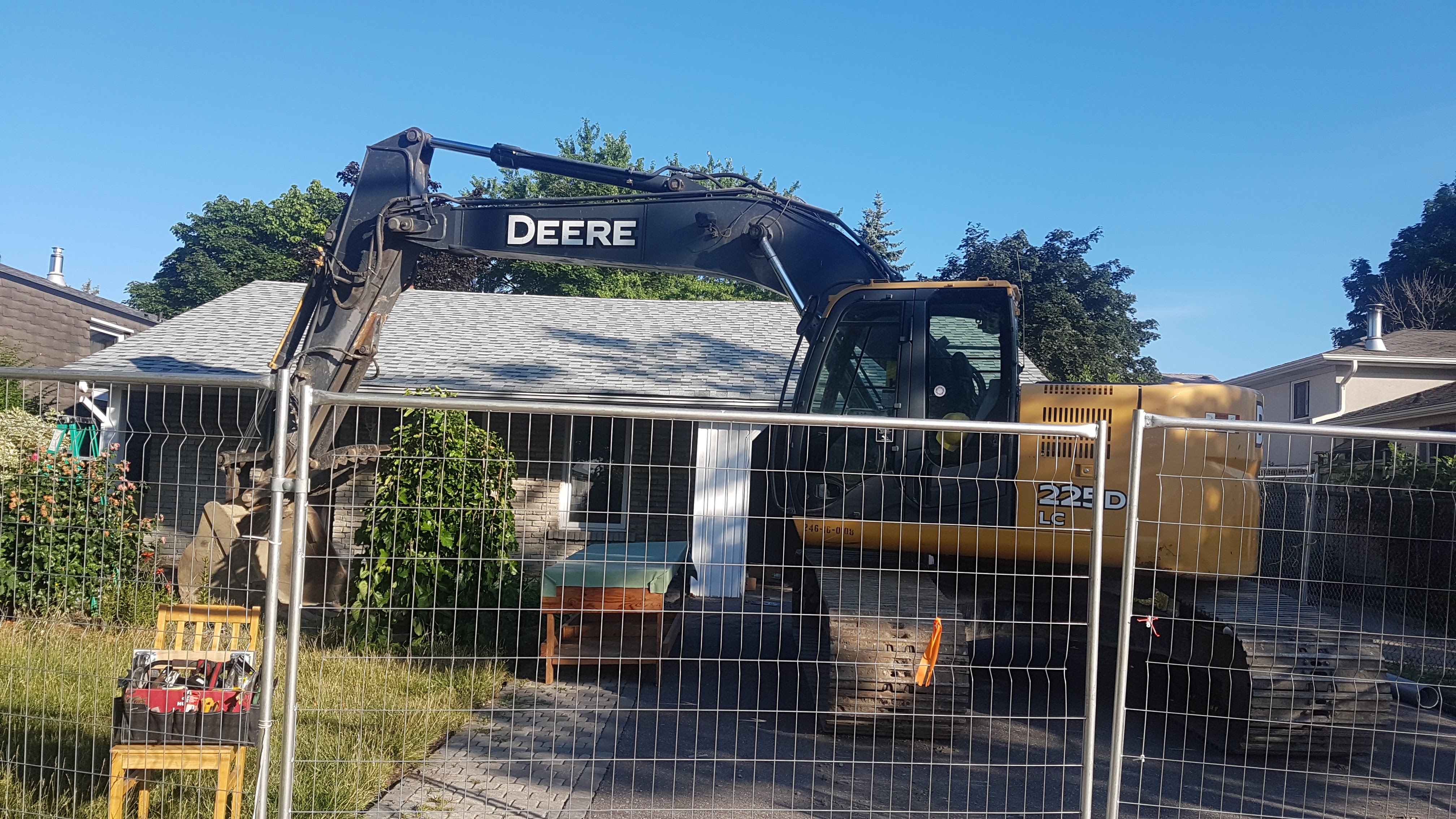 Excavator arriving at the residential construction site