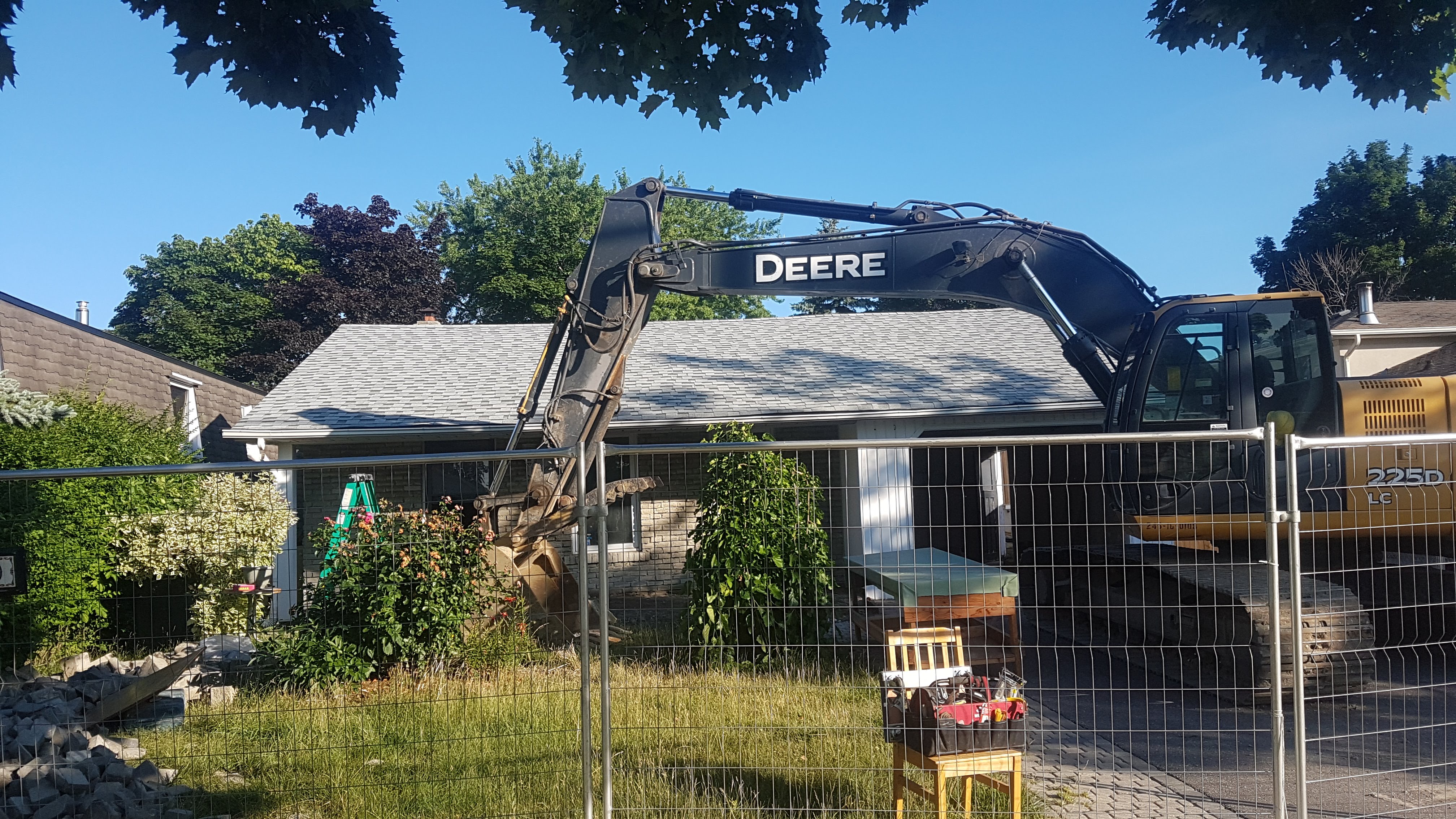 Excavator positioned for initial site preparation